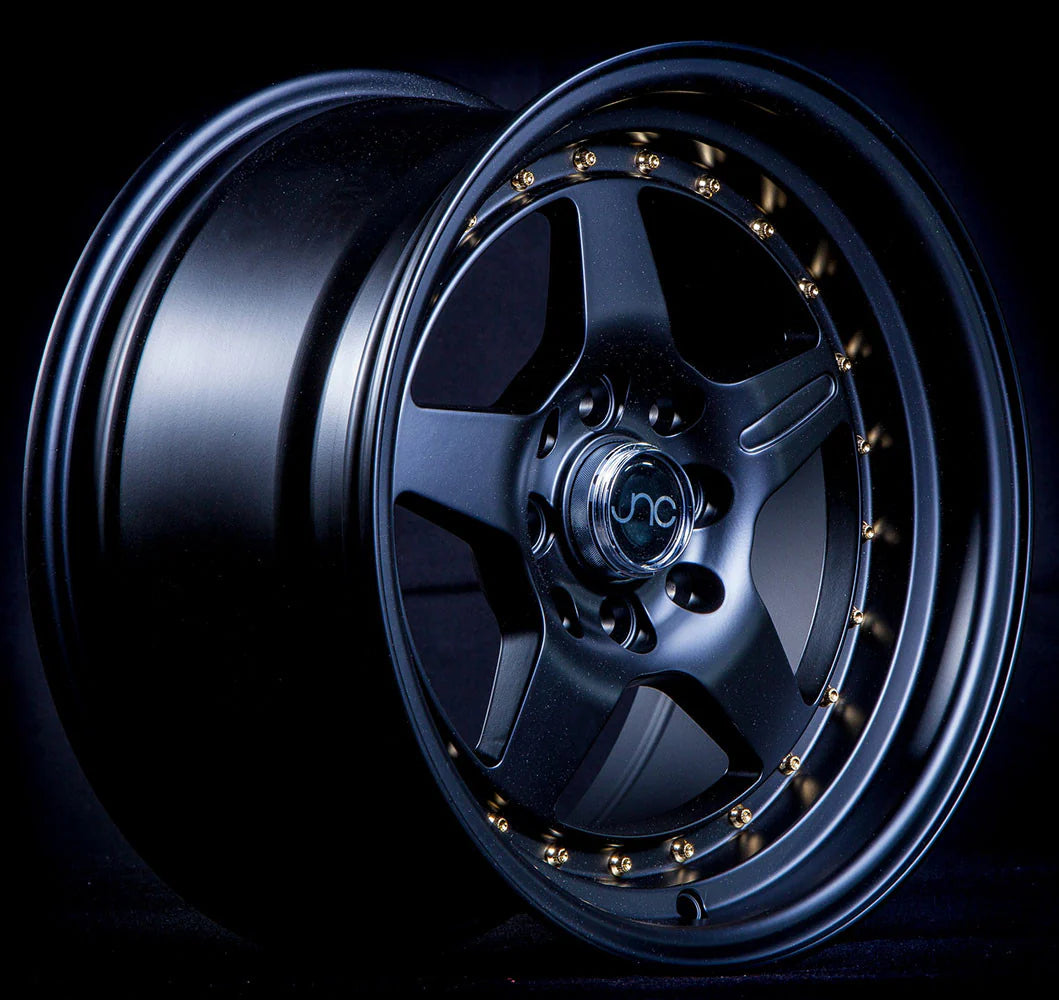 JNC JNC009 Matte Black Wheel With Gold Rivets - 15x8 / 4x100/4x114.3 / +25